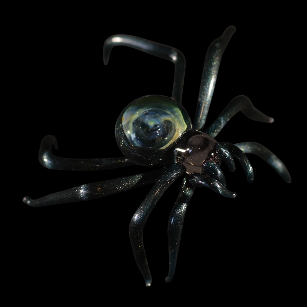 figurine in glass spider space